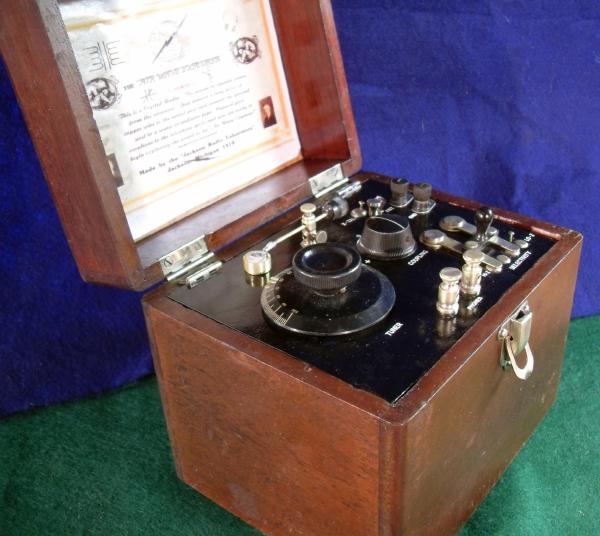 Beautiful ca.1919 Excellent working crystal radio. Variable link coupling. Panel hinges up to inspect the buss wiring and circuit components. SOLD--SOLD.)!